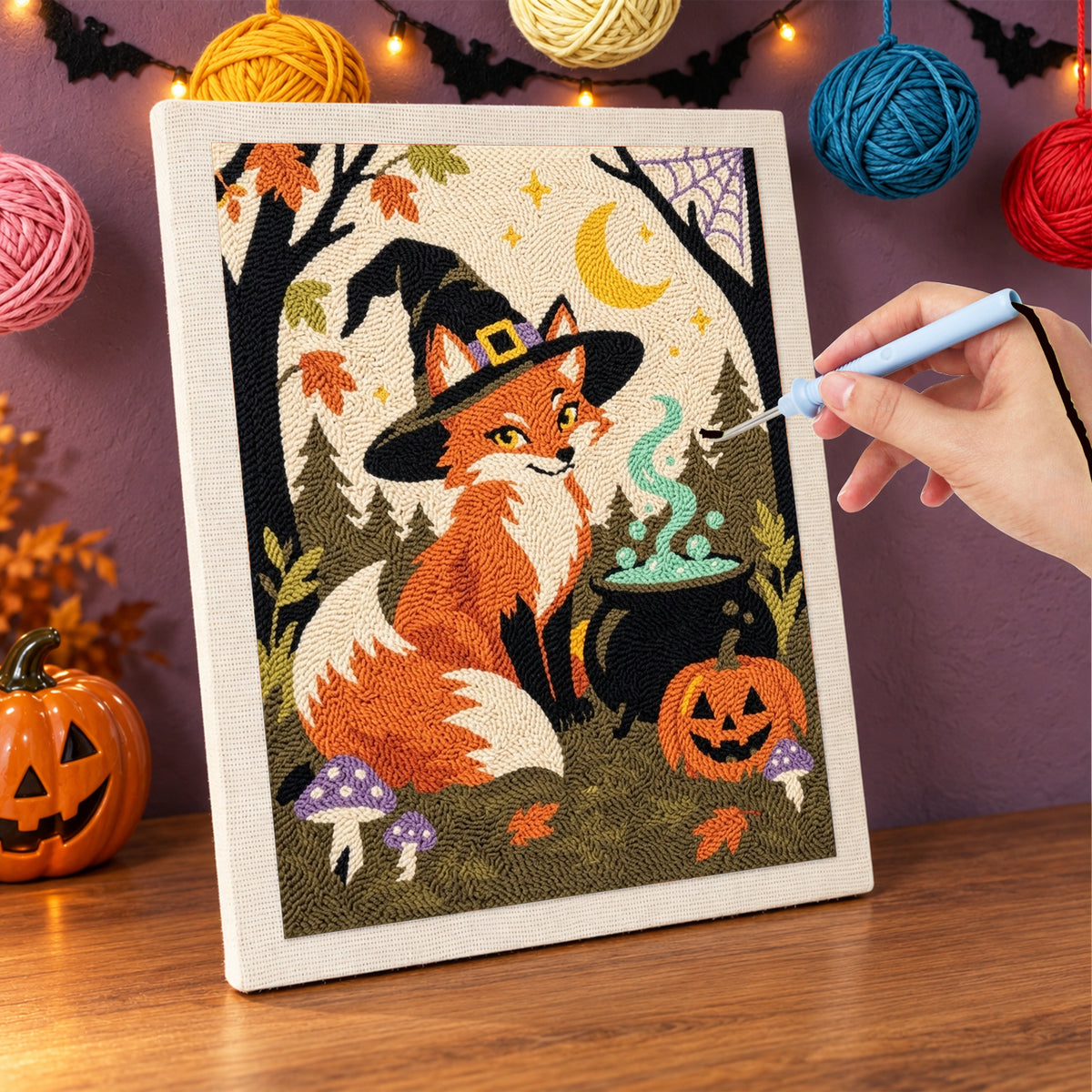 Punching the Fox Witch design with the punch needle