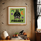 Finished Freaky Bat punch needle canvas on a wall