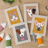 The four finished Frenchie and Bunny mini canvases laid out on a table