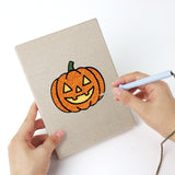 Punching a Frog and Ladybug mini canvas with the punch needle