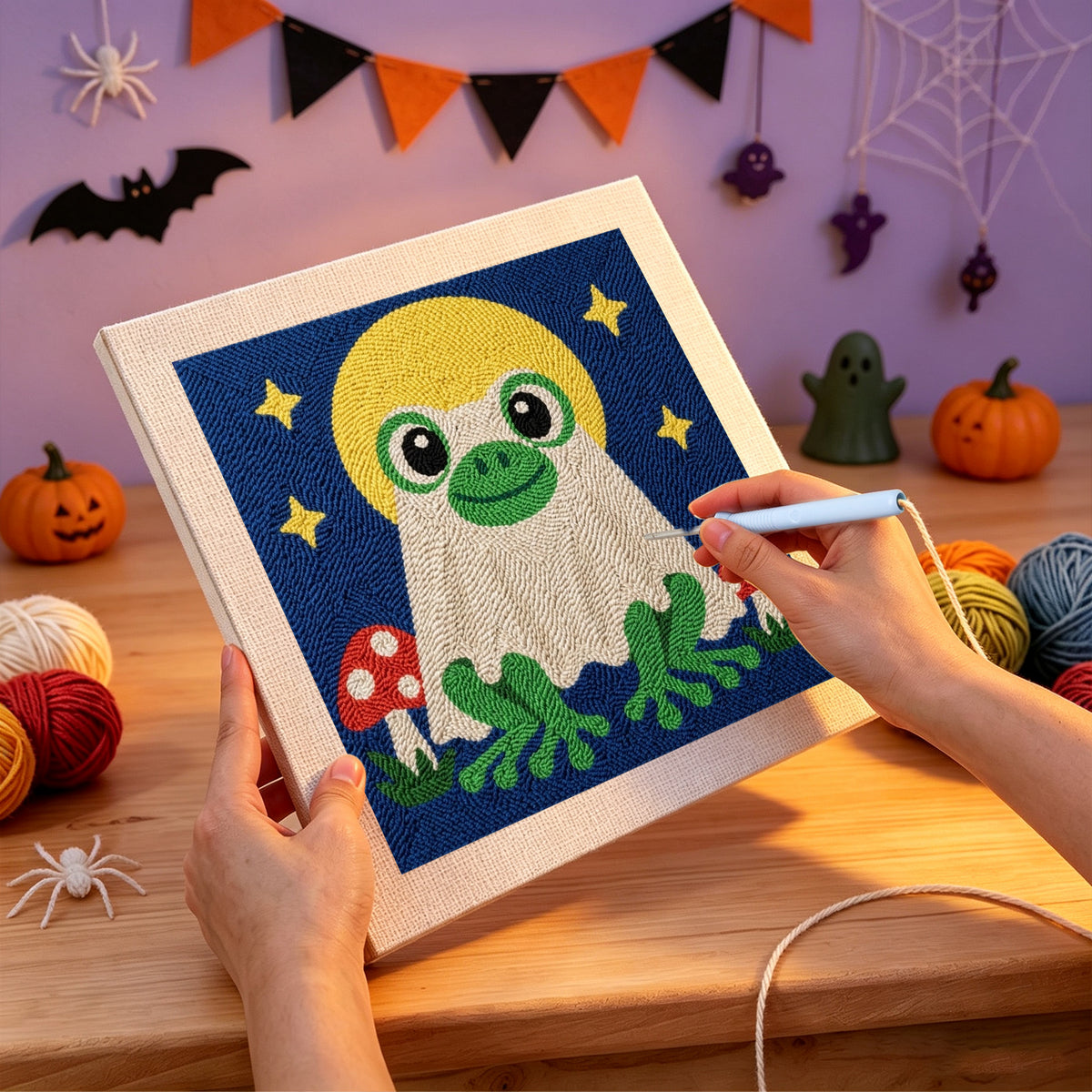 Punching the Frog Ghost at Full Moon design with the punch needle