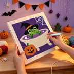 Punching the Frog Witch Bath design with the punch needle