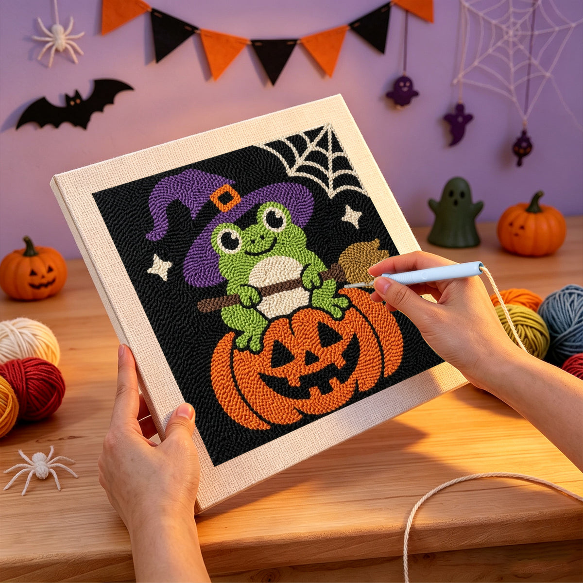 Punching the Frog Witch on a Pumpkin design with the punch needle