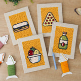 The four finished Fruit Bowl Pizza mini canvases laid out on a table