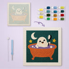 Ghost Bath Time canvas before and after punching, with the threads and tools