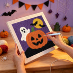 Punching the Ghost Behind the Pumpkin design with the punch needle