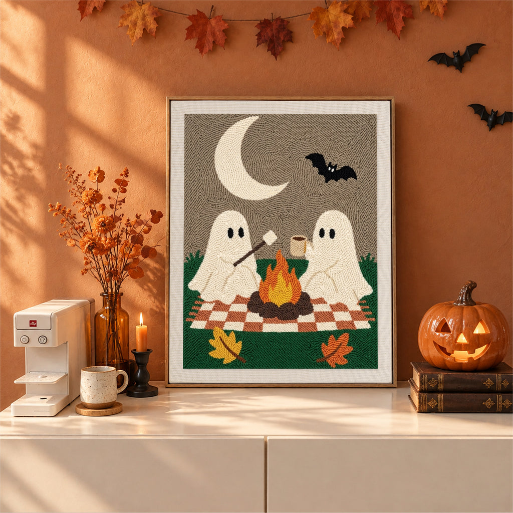 Finished Ghost Campfire Picnic punch needle canvas on a wall