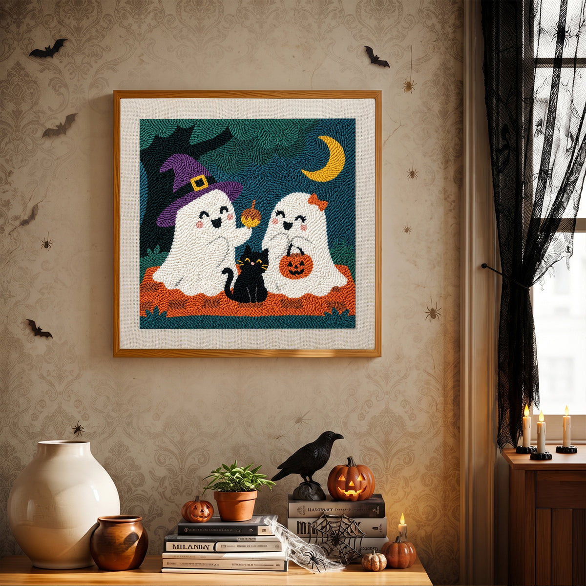 Finished Ghost Friends and Cat punch needle canvas on a wall