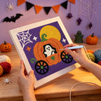 Punching the Ghost in a Pumpkin Coach design with the punch needle