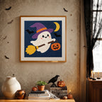 Finished Ghost on a Broom punch needle canvas on a wall