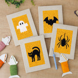 The four finished Ghost on Yellow mini canvases laid out on a table