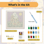 What is in the Ghosts Kiss in Gold kit: printed canvas, punch needle, threader, threads, color guide and hangers