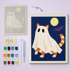 Ginger Cat Ghost canvas before and after punching, with the threads and tools