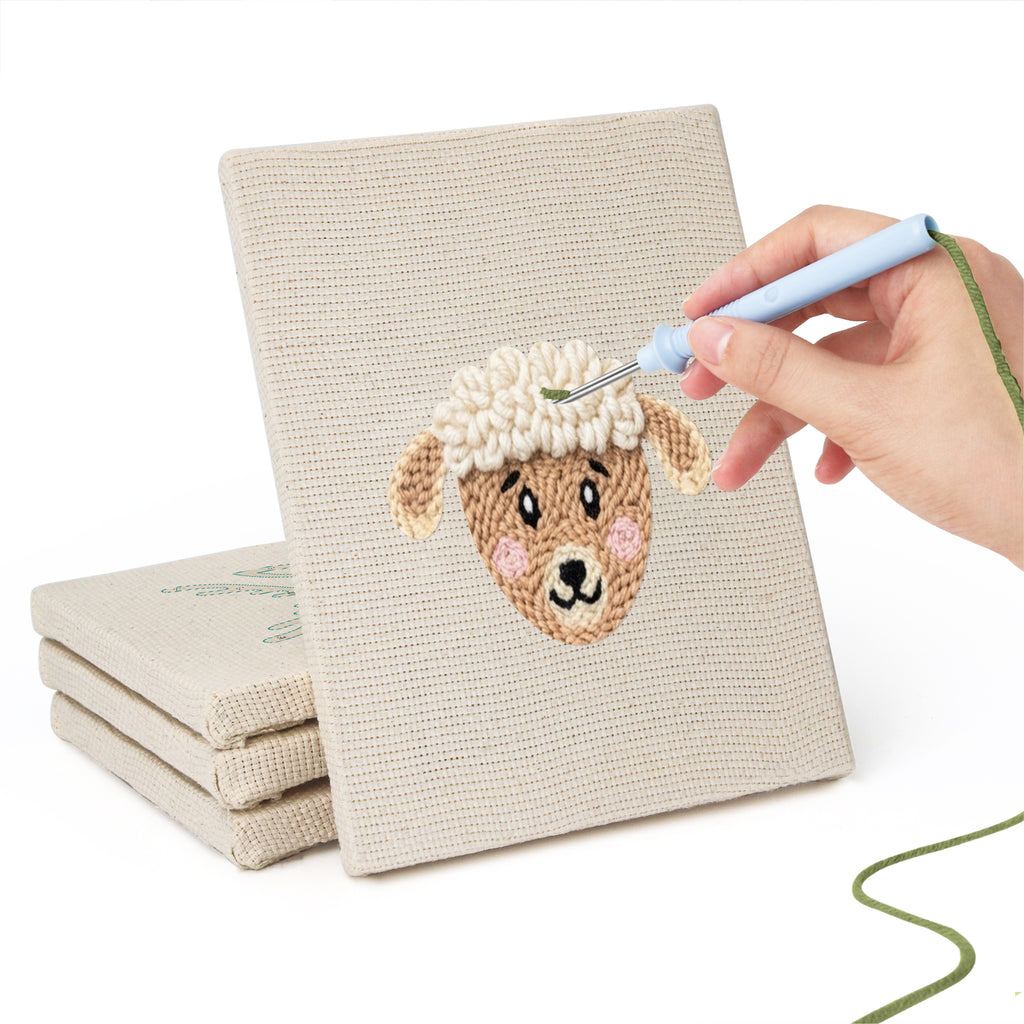 Hand punching one of the Giraffe and Deer mini canvases