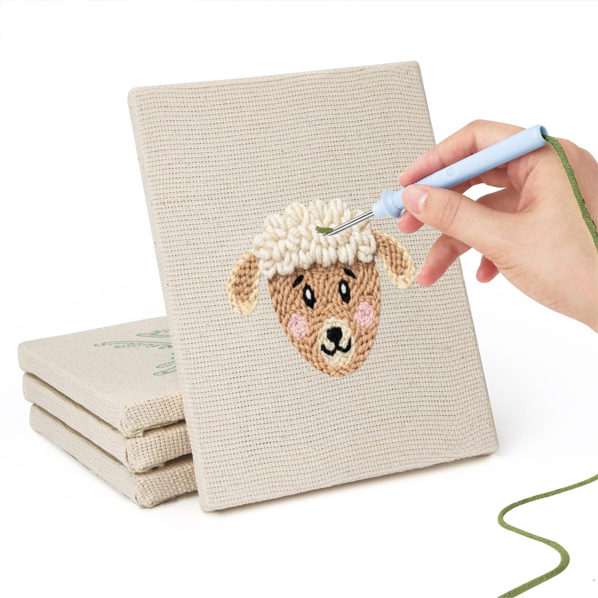 Hand punching one of the Giraffe and Deer mini canvases