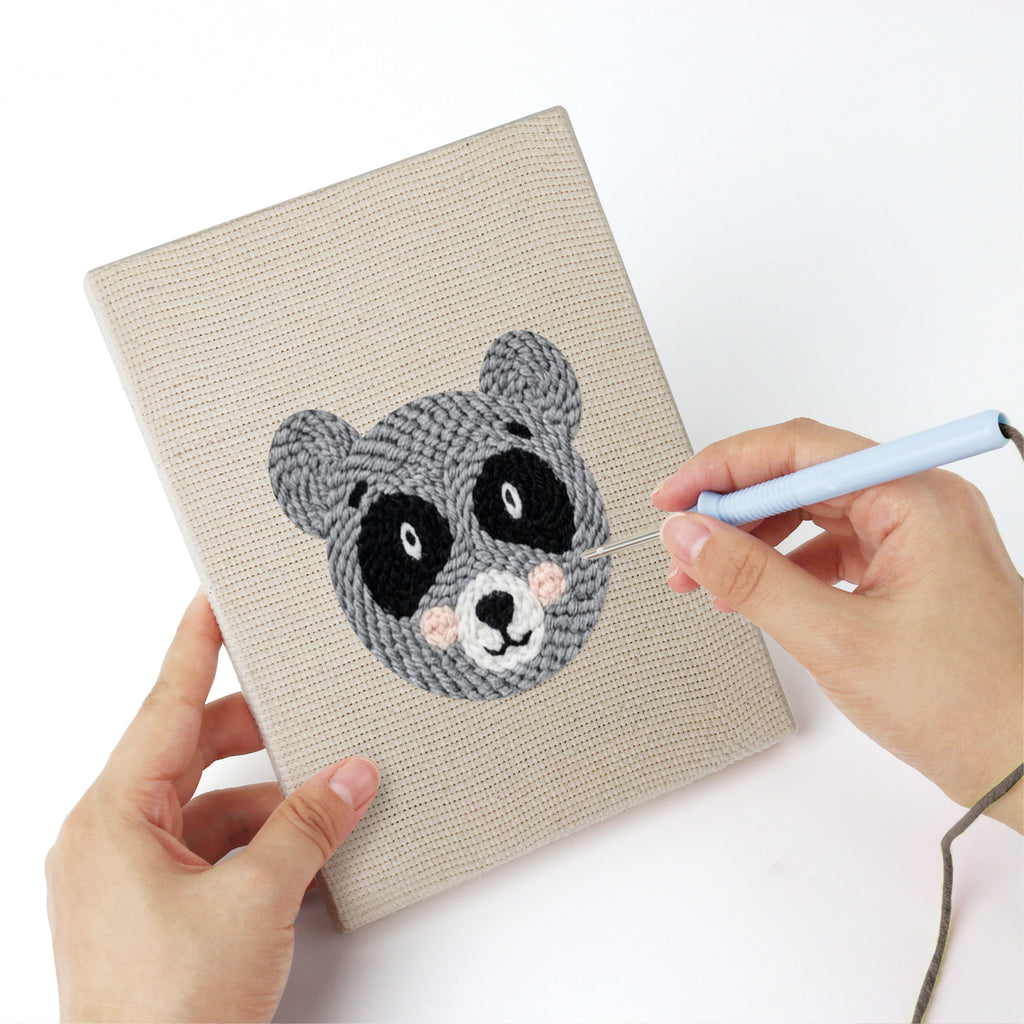 Punching a Giraffe and Deer mini canvas with the punch needle