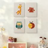 The four Giraffe and Friends mini canvases on a wall above a shelf