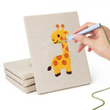 Hand punching one of the Giraffe and Turtle mini canvases