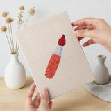 Hand holding a finished Glue Bottle Crafts mini canvas