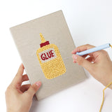 Punching a Glue Bottle Crafts mini canvas with the punch needle