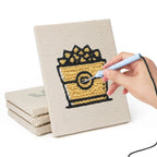 Hand punching one of the Golden Popcorn Bucket mini canvases