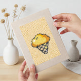 Hand holding a finished Golden Snack Time mini canvas