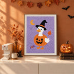 Finished Goose in a Pumpkin punch needle canvas on a wall