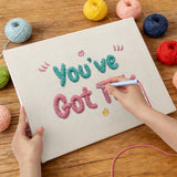 Punching the Got This Lettering design with the punch needle