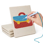 Hand punching one of the Graduation Satchel mini canvases