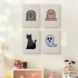 The four Graveyard Cat mini canvases on a wall above a shelf