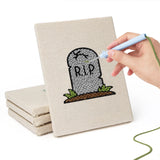 Hand punching one of the Graveyard Ghosts mini canvases