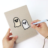 Punching a Graveyard Ghosts mini canvas with the punch needle