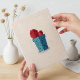 Hand holding a finished Gray Pot Cacti mini canvas