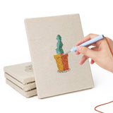 Hand punching one of the Gray Pot Cacti mini canvases