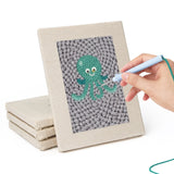 Hand punching one of the Gray Sea Friends mini canvases