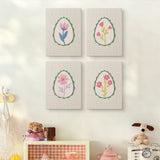 The four Green Egg Posies mini canvases on a wall above a shelf