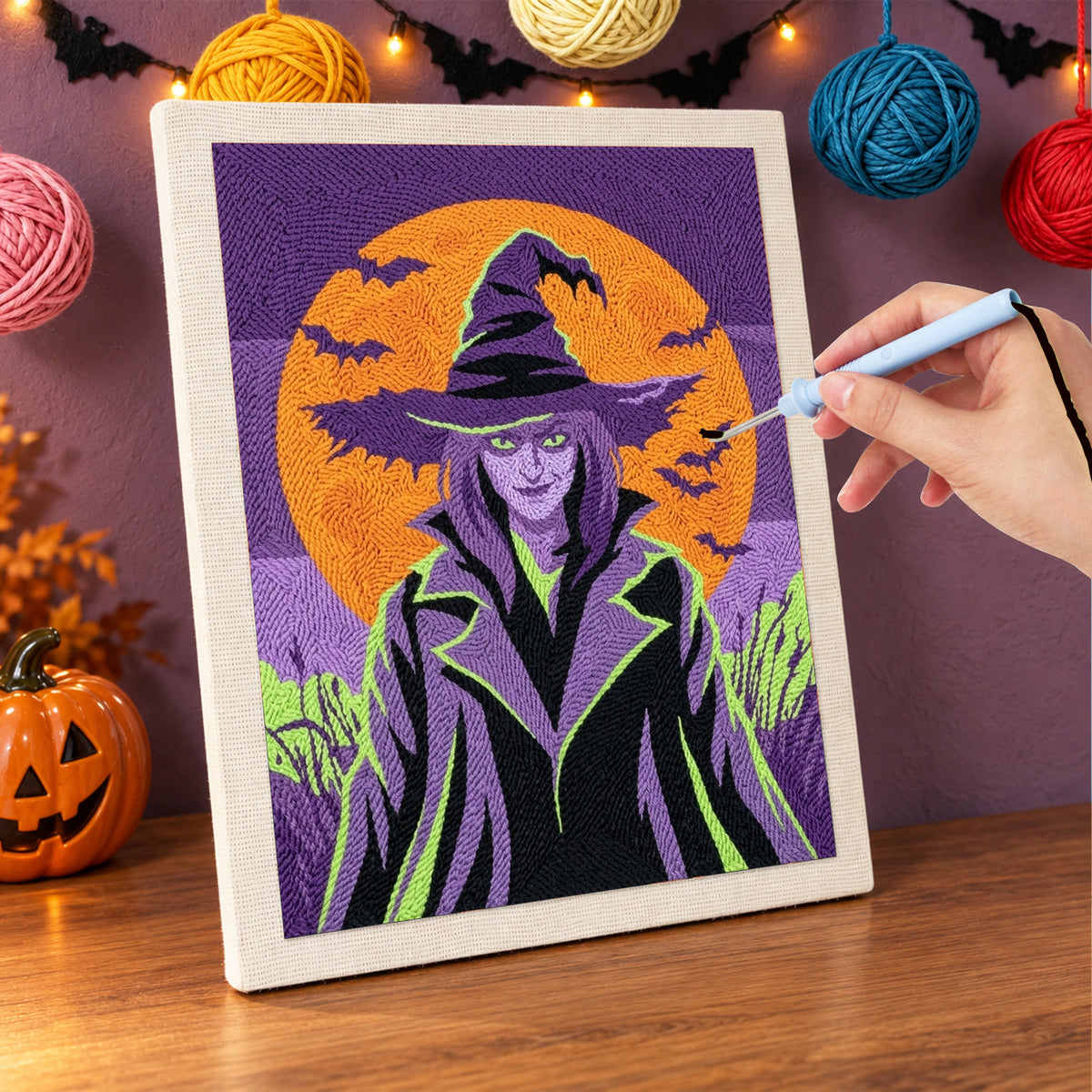 Punching the Green-Eyed Witch design with the punch needle