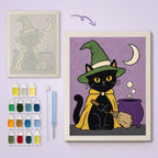 Green Hat Cauldron Cat canvas before and after punching, with the threads and tools