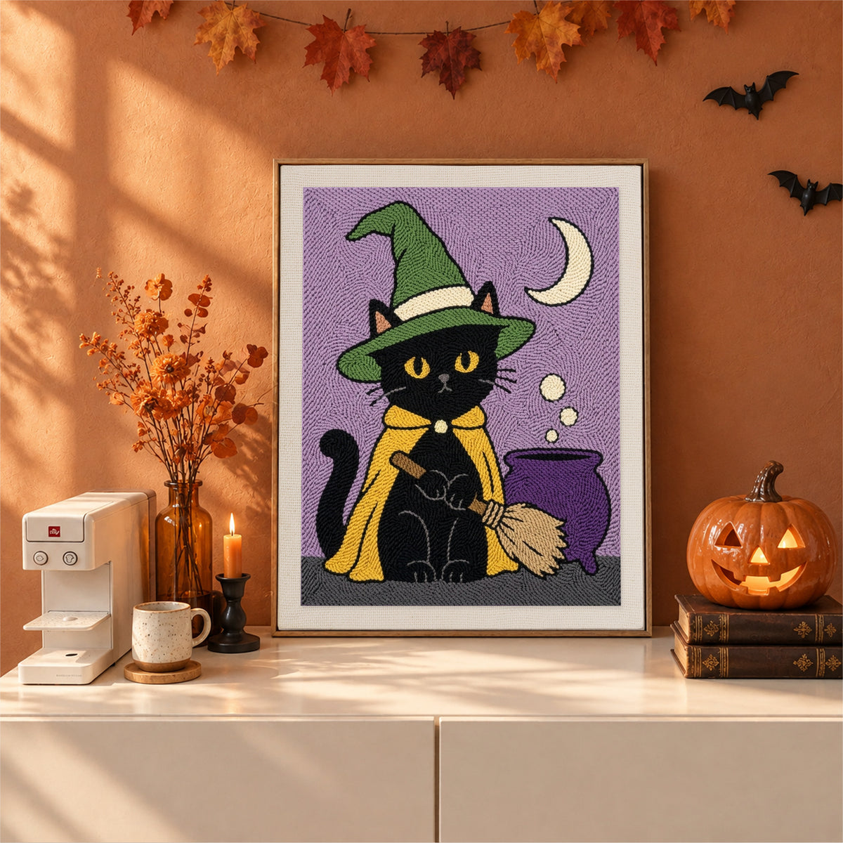 Finished Green Hat Cauldron Cat punch needle canvas on a wall