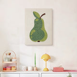 Finished Green Pear punch needle canvas on a wall