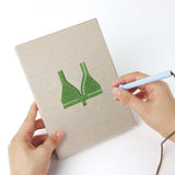 Punching a Green Polka Tops mini canvas with the punch needle