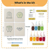 What is in the Green Skull Cauldron set, 8 × 12 in (20 × 30 cm) each: 4 printed canvases, punch needle, threader, threads, color guide and 4 sets of hangers