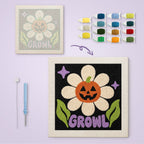 Growl Pumpkin Daisy canvas before and after punching, with the threads and tools