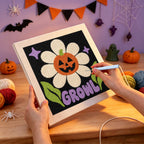 Punching the Growl Pumpkin Daisy design with the punch needle