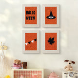 The four Halloween Bunting mini canvases on a wall above a shelf