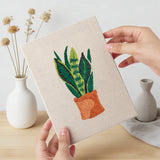 Hand holding a finished Hanging Plant Corner mini canvas