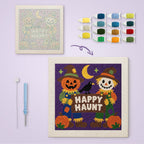 Happy Haunt Scarecrows canvas before and after punching, with the threads and tools