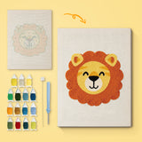 Happy Lion canvas before and after punching, with the threads and tools