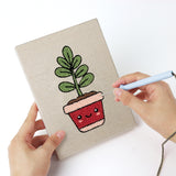 Punching a Happy Little Planters mini canvas with the punch needle