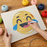 Punching the Happy Tears Face design with the punch needle